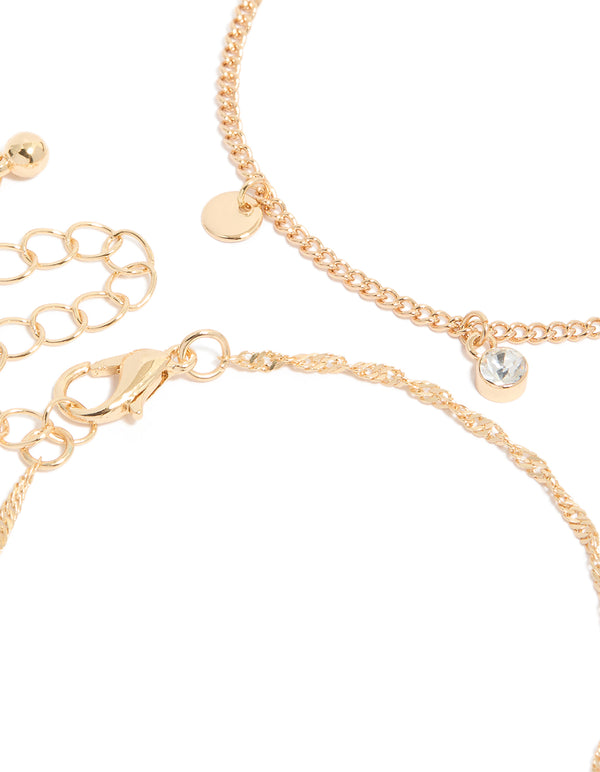 Designed with gold pink charm bracelets in a 4-pack closure detail view