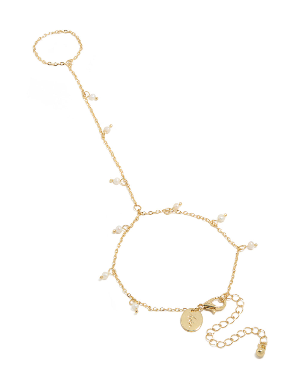 Discover this gold plated mini freshwater pearl droplet hand chain featuring charm accents in dainty statement style front view
