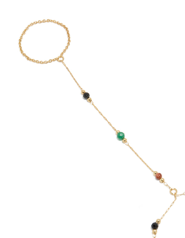 Featuring a gold plated multicoloured semi precious stone beaded hand chain in statement style close up view