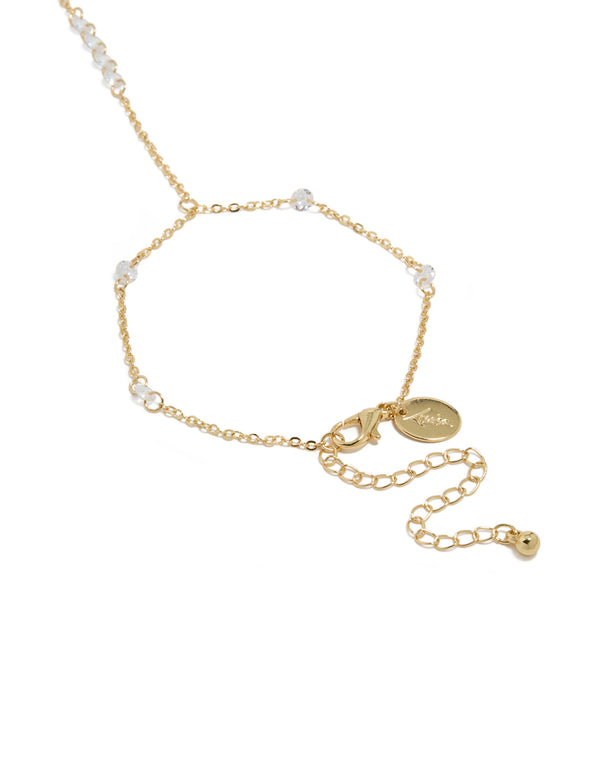 Beautifully crafted gold plated floating cubic zirconia hand chain bracelet with beads feature closure detail view