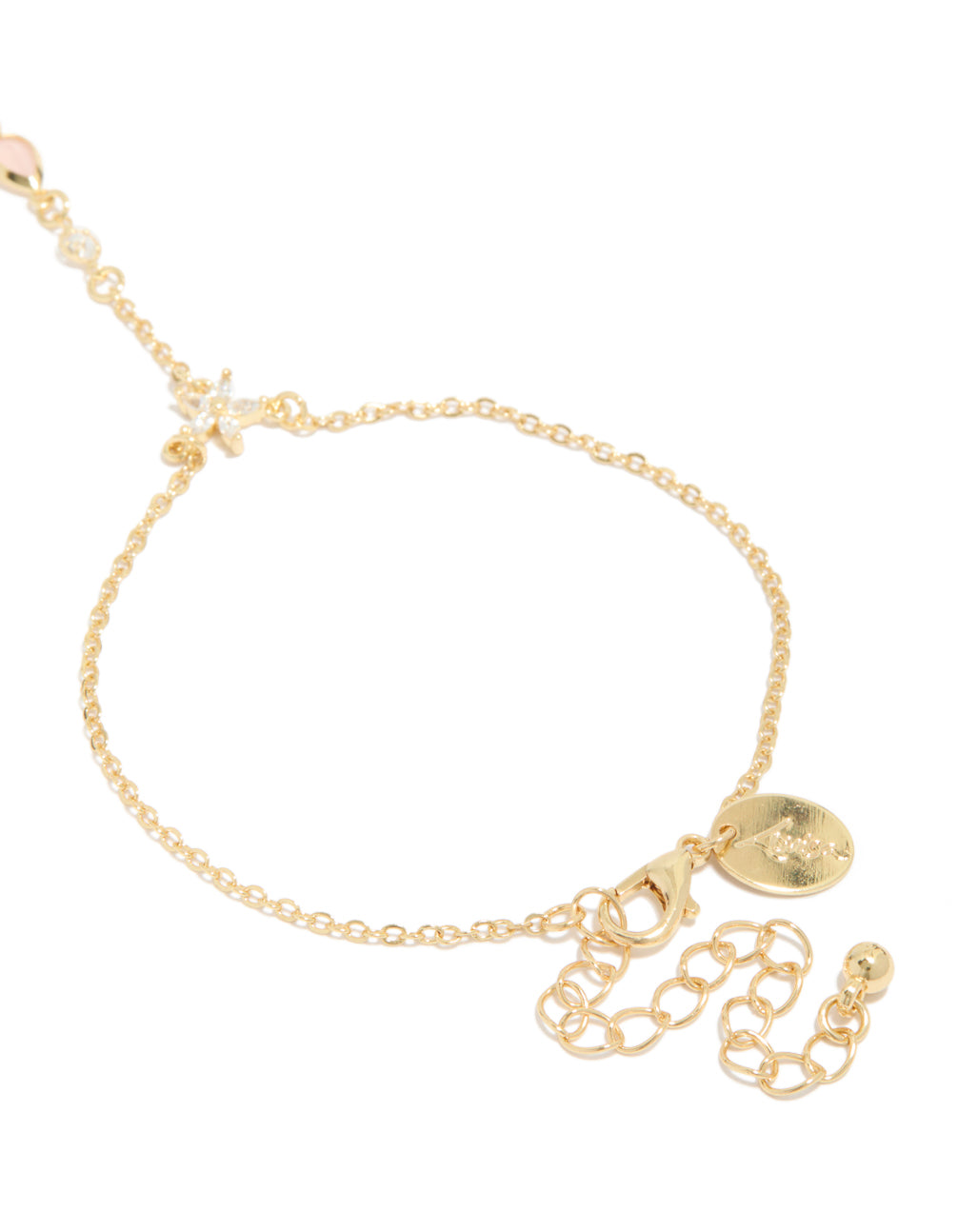 Designed with gold plated pink cubic zirconia teardrop hand chain bracelet in statement style closure detail view