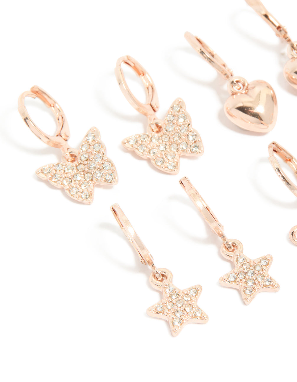 Featuring kids rose gold diamante pavé huggie earrings in a 4-pack with bow, celestial, heart, and butterfly details close up view