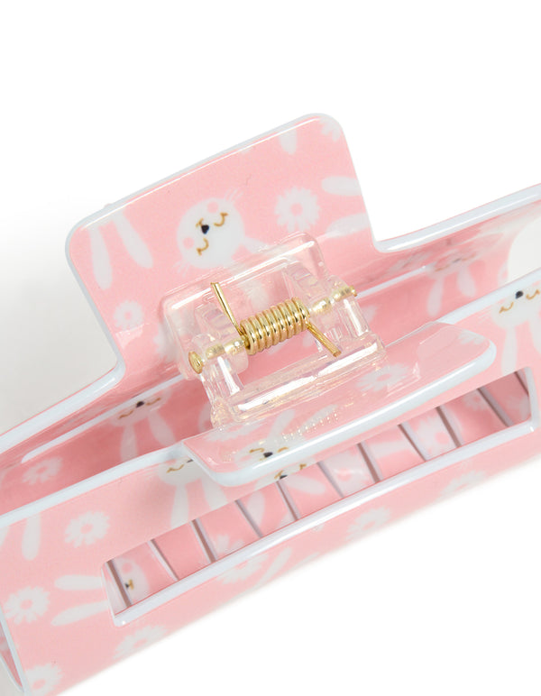 Designed with floral and animal elements, this kids pink acrylic bunny print claw clip showcases white and gold hardware detail view