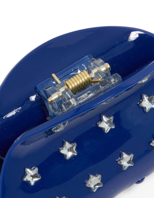 This blue cutie star hair claw features celestial design with in novelty print navy and silver detail view