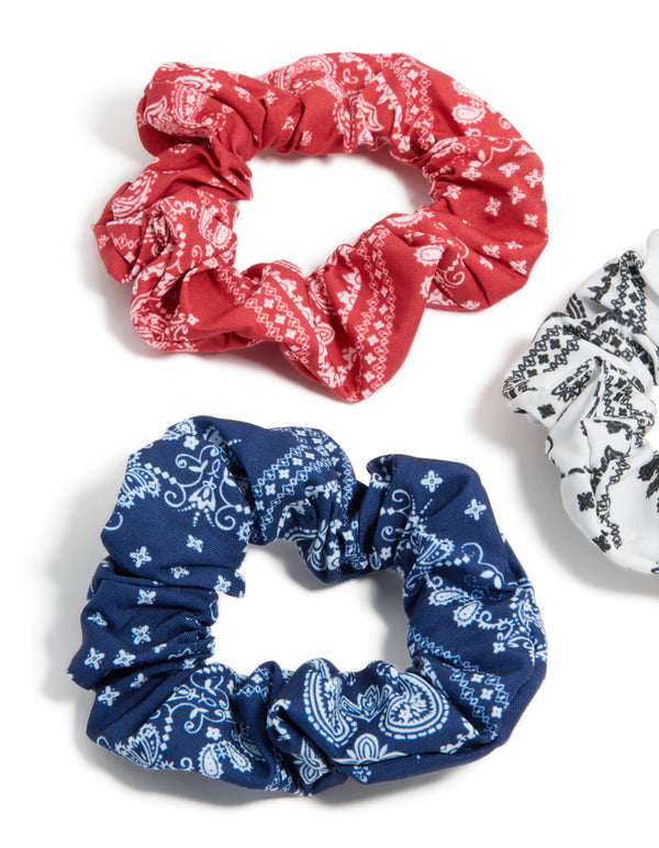 Showcasing paisley print fabric scrunchies in a 3-pack with navy, white, coral, and light sky blue side view