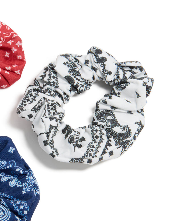 Featuring paisley print fabric scrunchies in a 3-pack with navy, white, coral, and light sky blue detail view