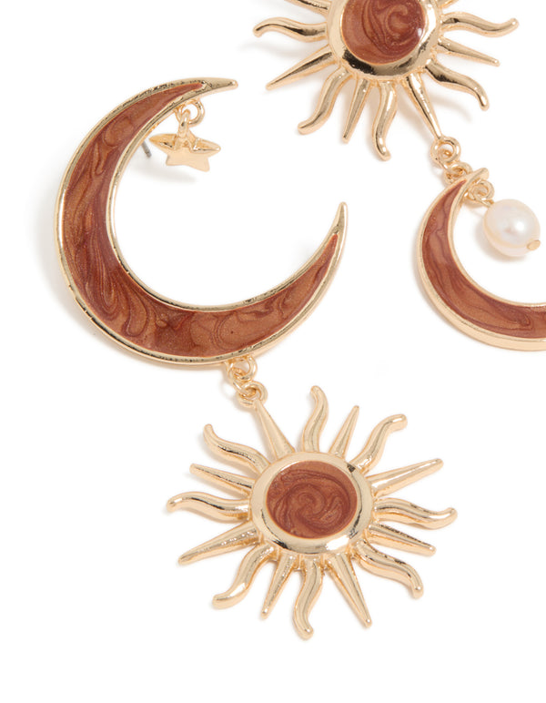 Beautifully crafted gold celestial brown marble drop earrings with pearl and charm details close up view