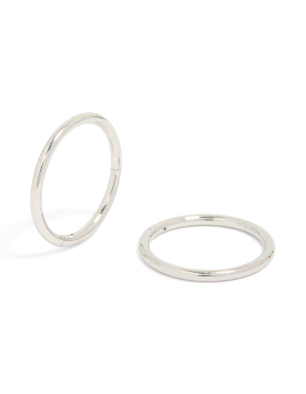 Showcasing statement chunky surgical steel sleeper hoop earrings in silver front view