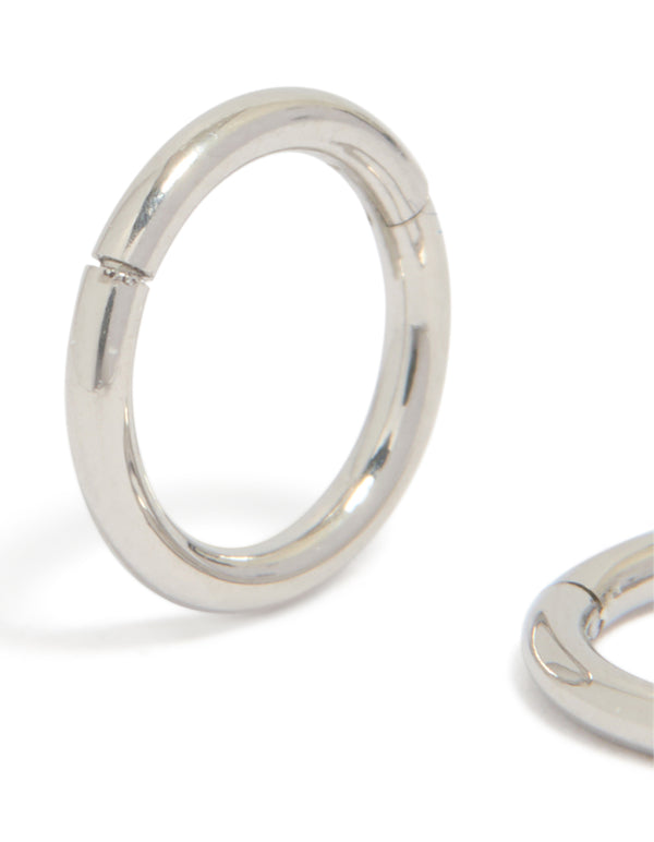 Detailed view of chunky surgical steel 6 mm thick sleeper hoop earrings in silver with closure mechanism close up view