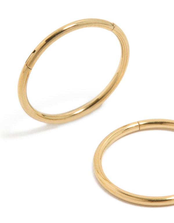Featuring gold plated surgical steel thick sleeper earrings in 12 MM with hoop closure close up view