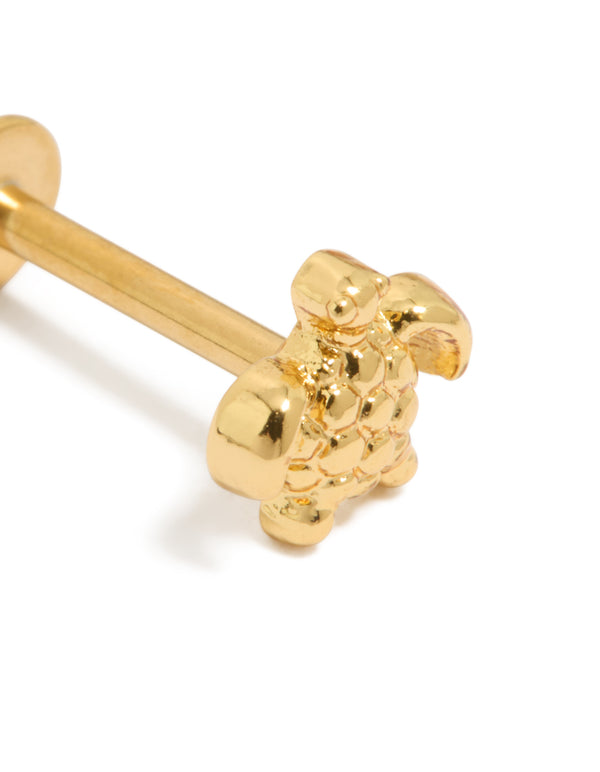 Featuring an animal motif ocean theme, this gold plated surgical steel turtle stud earring with flat back closure close up view