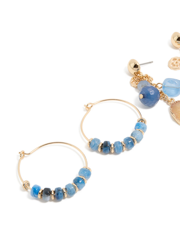 Crafted from gold with blue beaded details, this statement hoop and drop earring 3-pack offers charm-enhanced styling close up view