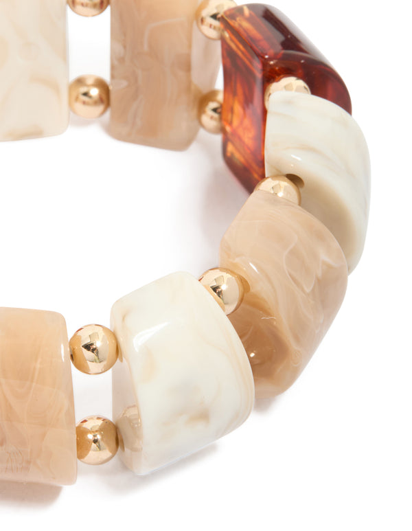 Crafted with alternating rectangular acrylic beads in brown cream featuring gold spacer balls details close up view