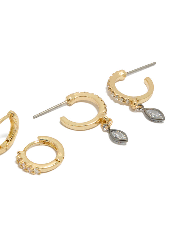 Discover mixed metal plated cubic zirconia bezel stud and huggie earrings in a 3-pack with gold, silver, and clear accents post detail view