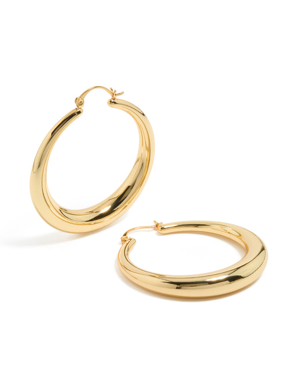 Showcasing gold plated thick thin hoop earrings with closure front view