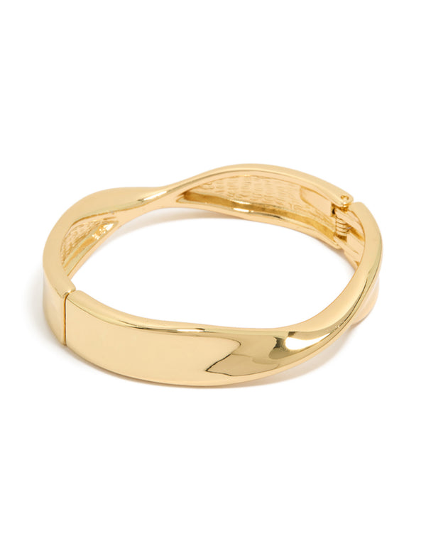 Crafted from gold plated material, this twisted thick statement chunky bangle features a bold design front view