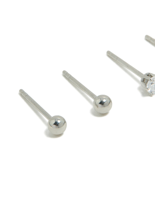 Kids surgical steel stud earrings featuring cubic zirconia and ball in a 2-pack with silver and aqua tones close up view