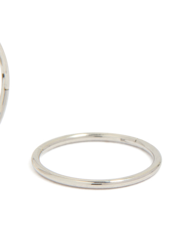 Featuring kids surgical steel sleeper earrings with dainty, hoop closure in silver post detail view