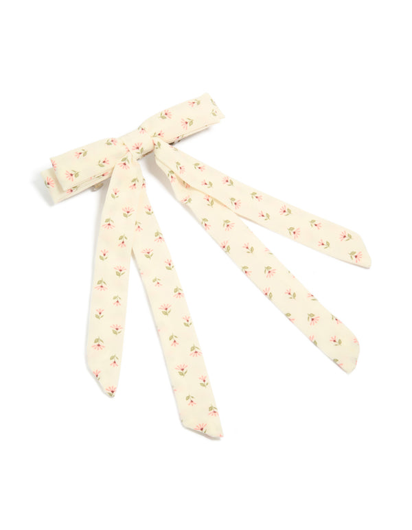 Showcasing a cream pink flowers printed fabric bow clip with ivory and light pink floral pattern featuring olive drab leaf accents front view