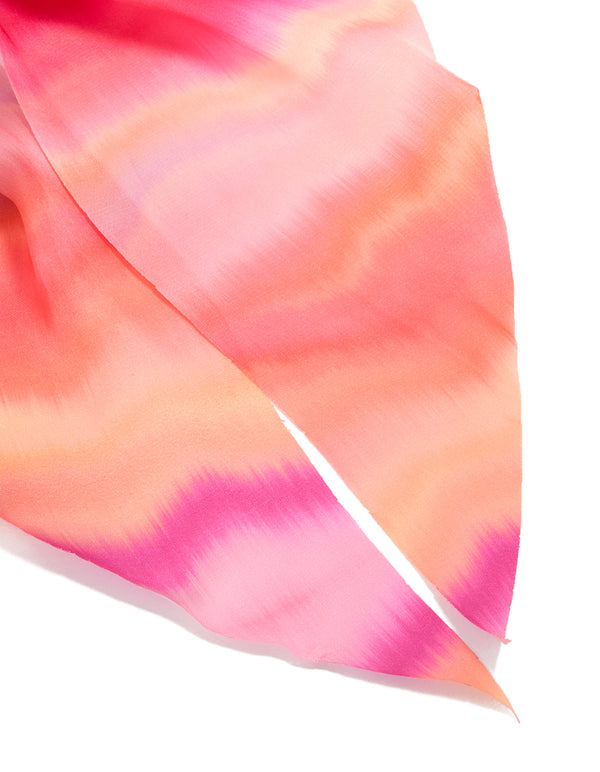 Beautifully crafted statement scarf scrunchie with tie-dye pattern in hot pink, coral, and peachpuff hues side view