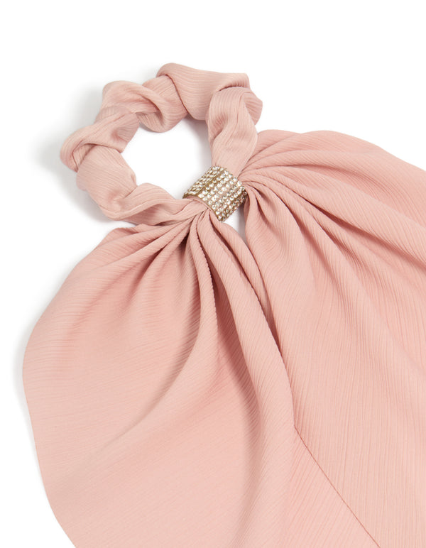 Crafted from light pink fabric, this diamante long scarf scrunchie features solid print with silver accents side view
