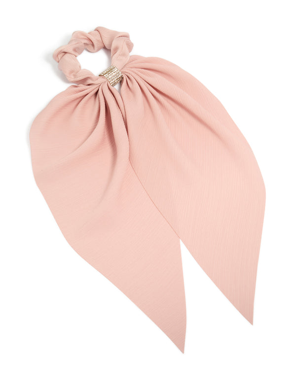 Showcasing a peach pink diamante long scarf scrunchie with solid print in light pink and silver front view