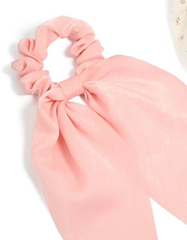 Crafted with bow detail in floral pattern, this 2-pack set features light pink, ivory, pink, and olive printed flowers and fabric scarf scrunchies detail view