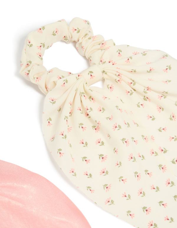 Designed with bow in floral pattern, these 2-pack printed flowers and pink fabric scarf scrunchies showcase light pink, ivory, and olive colors side view