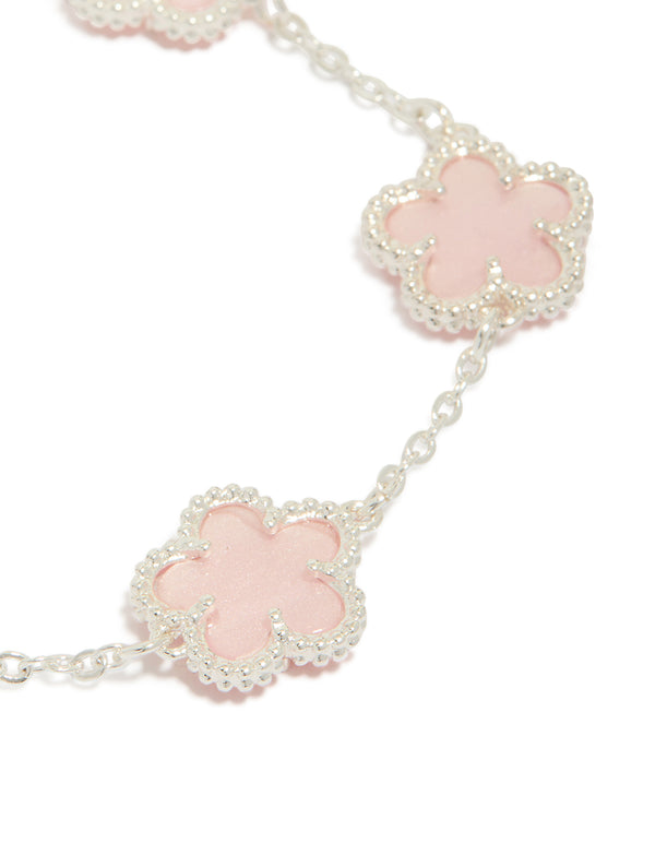Designed with silver plated finish is this pink flower charms station bracelet featuring floral pattern in dainty style close up view