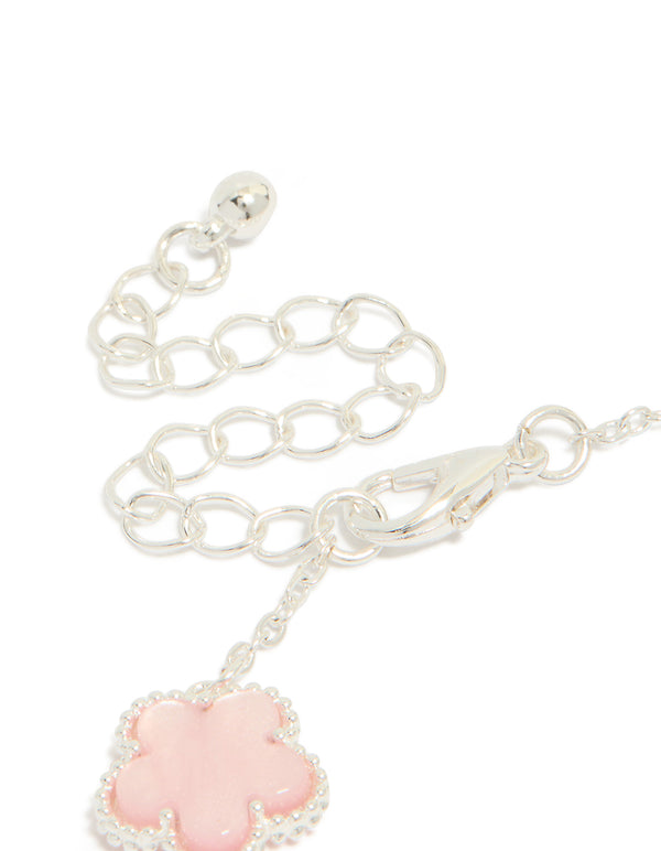 Highlighting the silver plated pink flower charms station bracelet with floral pattern in dainty style closure detail view