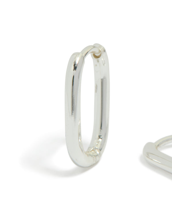 Beautifully crafted waterproof silver plated stainless steel rectangle huggie earrings featuring huggie closure in silver close up view
