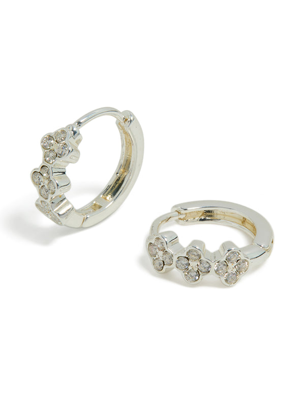 Discover these dainty waterproof stainless steel cubic zirconia triple flower huggie earrings with crystal details in silver front view