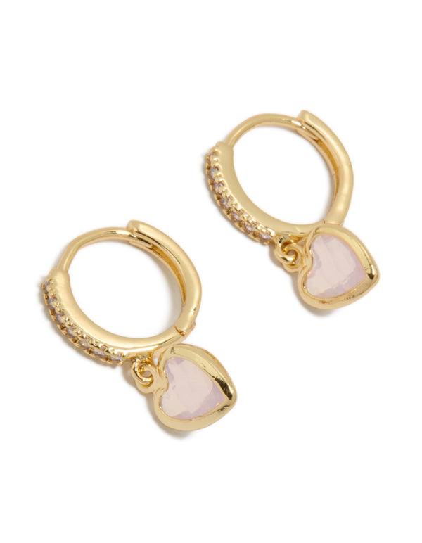Showcasing dainty gold plated cubic zirconia and pink heart drop huggie earrings in a front view