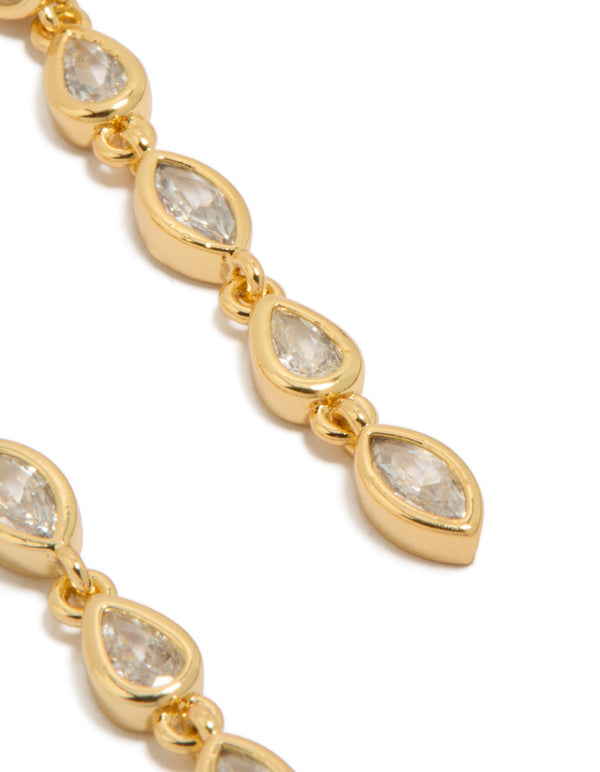 Detailed perspective of statement long drop earrings with mixed shape cubic zirconia stones set in gold plated metal detail view
