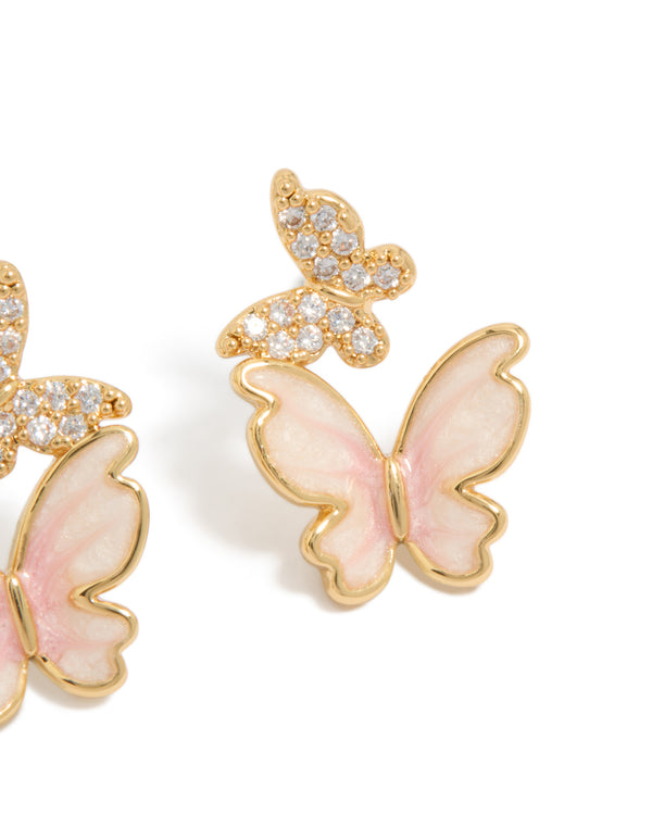 Featuring small butterfly stud earrings in gold plated finish with pink enamel and cubic zirconia post detail view