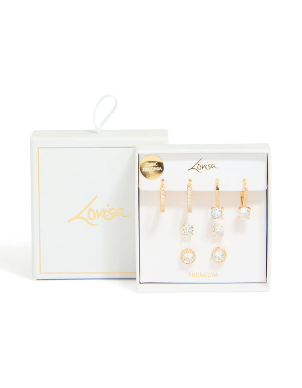 Featuring gold plated cubic zirconia mixed stud and huggie earrings in a 4-pack with crystal accents and huggie closures front view
