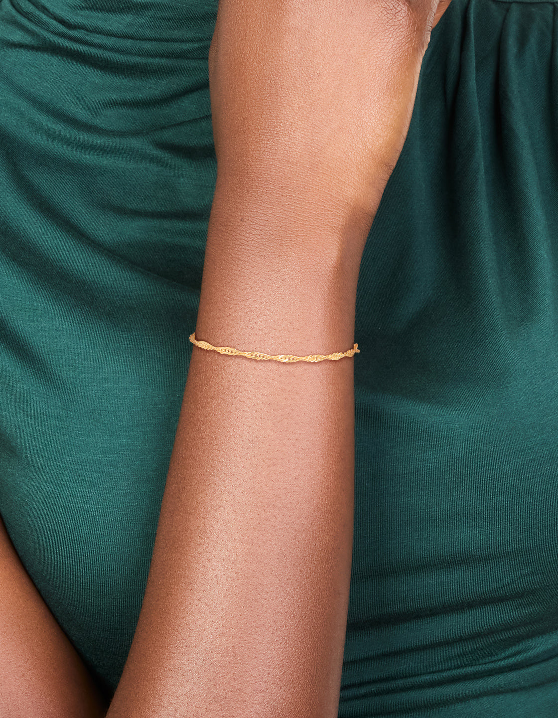 Crafted from gold plated material, this double helix toggle bracelet sits elegantly on wrist view