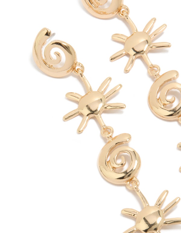 Showcasing statement gold shell and sun drop earrings with celestial and ocean-inspired design close up view