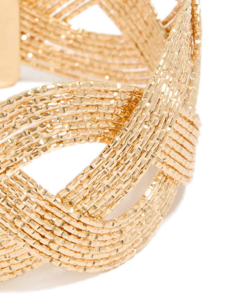 Detailed view of a plaited wrist cuff in gold, highlighting bangle texture close up view