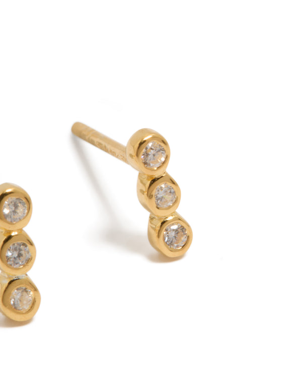 Highlighting gold plated sterling silver cubic zirconia bezel trio drop stud earrings with clear accents post detail view