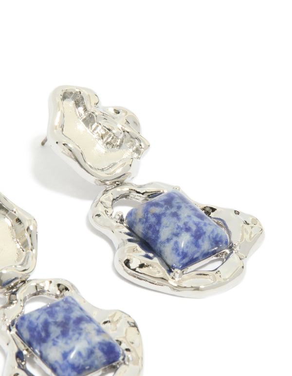 Elegant silver molten semi precious stone drop earrings highlighting blue gemstones in post detail view