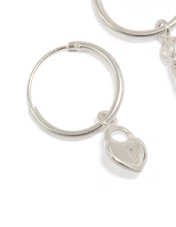 Beautiful statement hoop earrings crafted from sterling silver with heart and key featuring padlock detail close up view