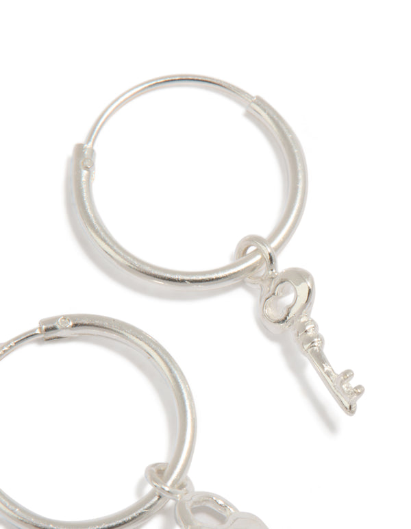 Beautiful statement hoop earrings crafted from sterling silver with heart and key featuring padlock detail close up view