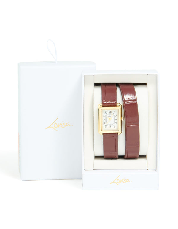 Highlighting a women's analog watch with white roman rectangle dial, brown leather strap, and gold PU material designed for formal events case detail view