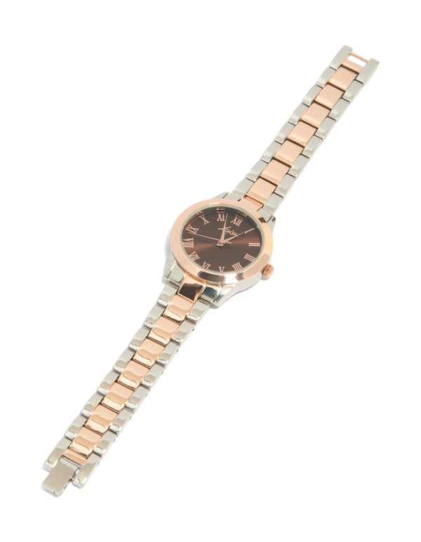 Elegant mixed metal watch with brown roman numeral dial, round shape, formal occasion, women's analog timepiece, link band in multi-color, gold and silver tones front view