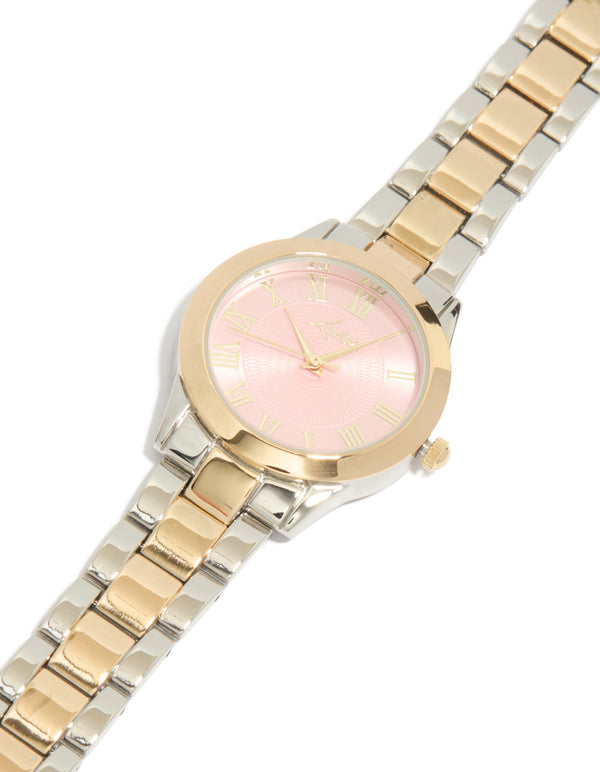 Showcasing a mixed metal pink face roman numeral watch with numbers on a round dial, designed for women in casual settings, featuring a multi-color link band and analog type watch face detail view