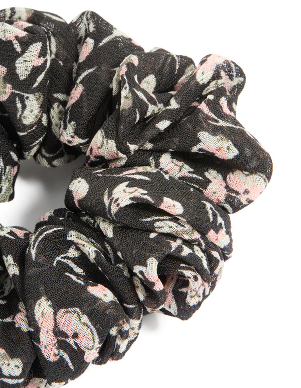 Beautifully crafted scattered floral printed statement scrunchie in black, light pink, beige side view