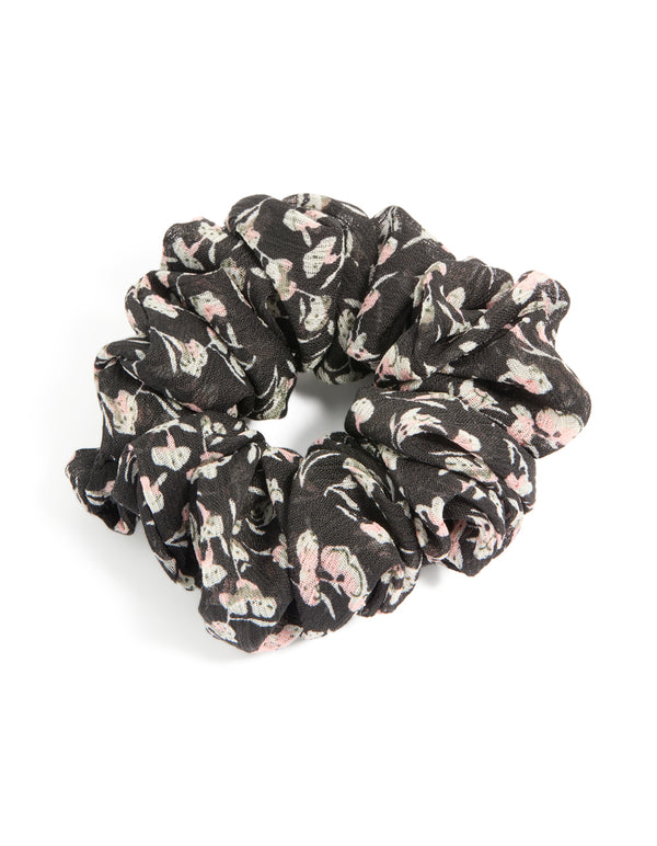 Showcasing a scattered floral printed statement scrunchie in black, light pink, beige front view