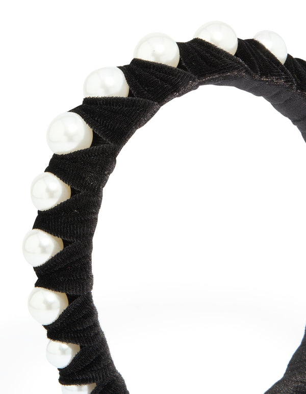 Elegant black fabric and pearl wrap headband featuring solid print in white side view