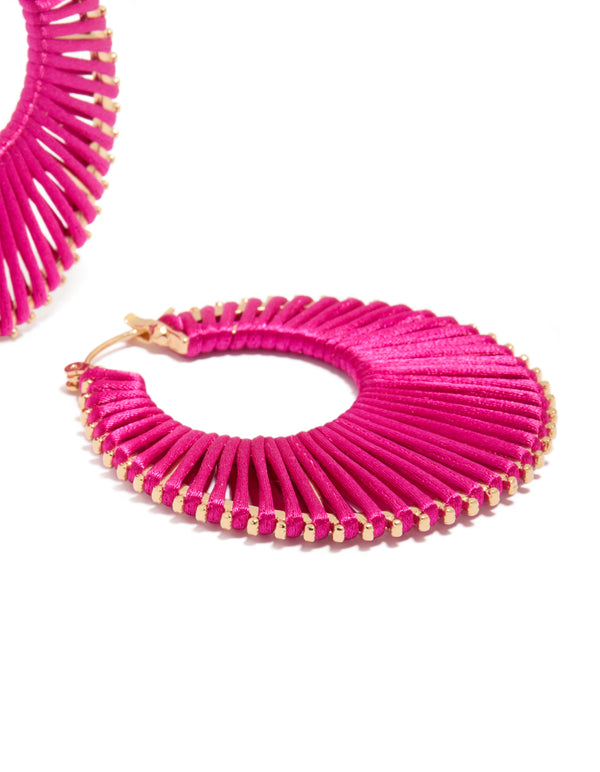 Displaying statement hoop earrings in hot pink and gold detail view